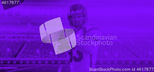 Image of duo toned american football player in  arena at night