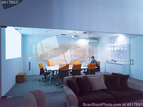 Image of businessman working using a laptop in startup office