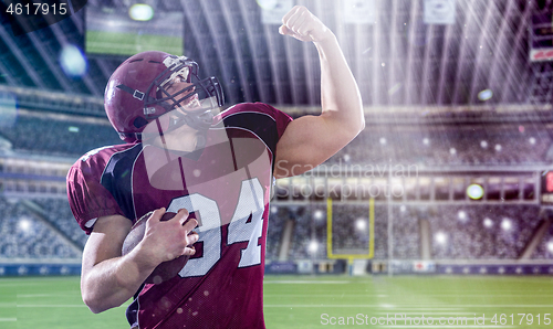 Image of american football player celebrating touchdown