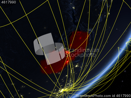 Image of Zambia on dark Earth with network