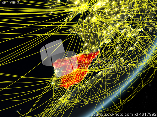 Image of Spain on dark Earth with network