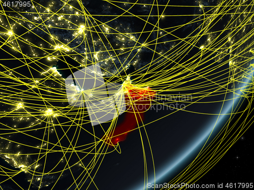 Image of Oman on dark Earth with network