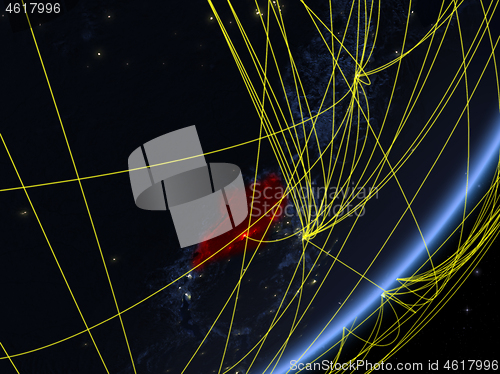 Image of Uganda on dark Earth with network