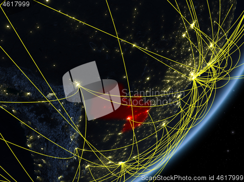 Image of Paraguay on dark Earth with network
