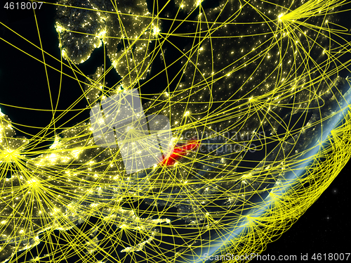 Image of Slovakia on dark Earth with network