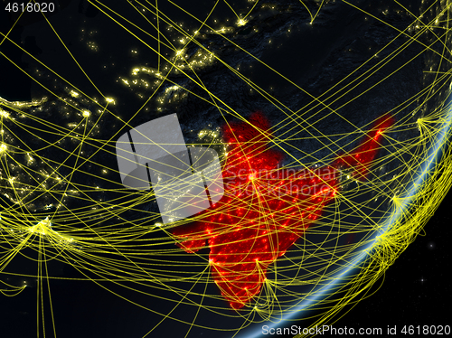 Image of India on dark Earth with network