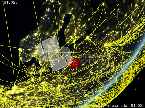 Image of Lithuania on dark Earth with network