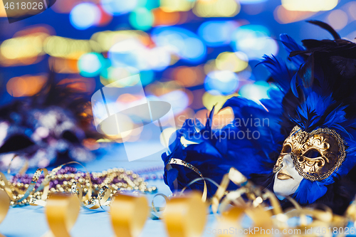 Image of Traditional female carnival venetian mask on bokeh background. Masquerade, Venice, Mardi Gras, Brazil concept