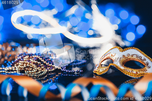 Image of Traditional female carnival venetian mask on bokeh background. Masquerade, Venice, Mardi Gras, Brazil concept