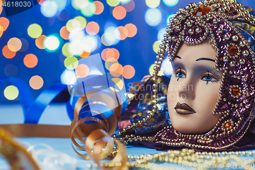 Image of Traditional female carnival venetian mask on bokeh background. Masquerade, Venice, Mardi Gras, Brazil concept