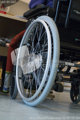 Image of Wheelchair by the Table