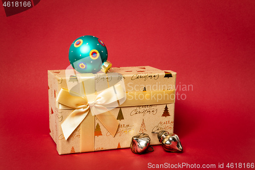 Image of Christmas gift box on red background