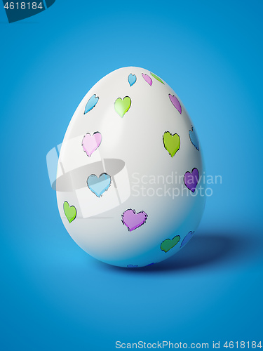 Image of easter egg with hearts on blue background