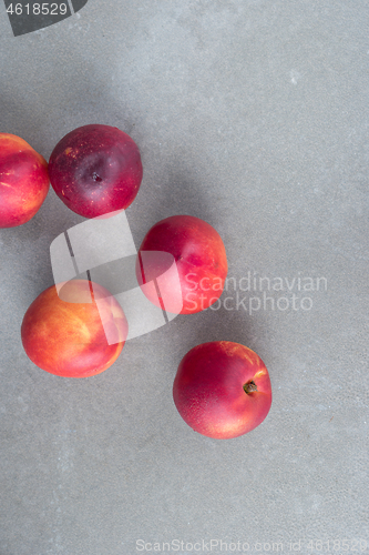 Image of Fresh peaches on concrete