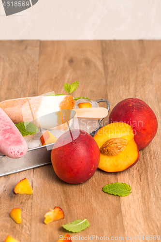 Image of Homemade raspberries and peach popsicles