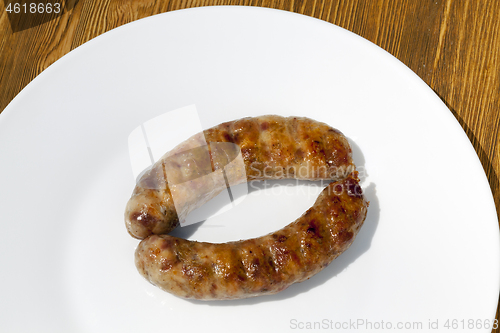 Image of two meat pork sausages