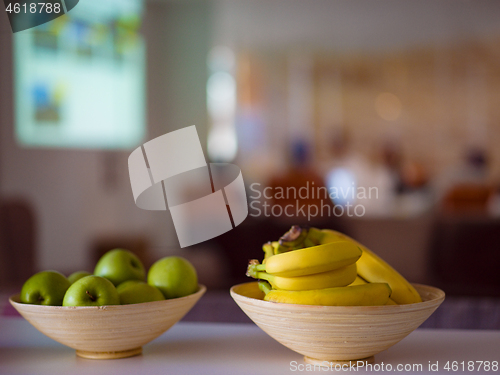 Image of Two bowl with with bananas and apples