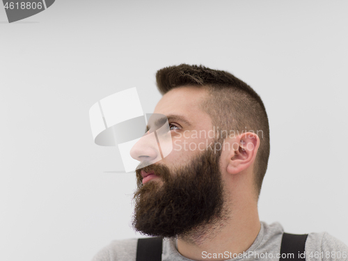 Image of portrait of bearded hipster handyman isolated on white