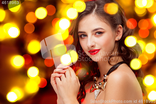 Image of Beautiful girl and shiny background with lights