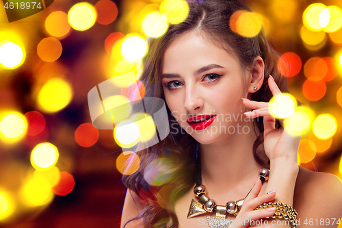 Image of Beautiful girl and shiny background with lights