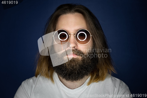 Image of bearded young man with long hair and sunglasses