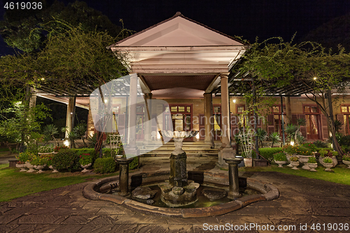 Image of Old classic style vintage home with veranda and garden