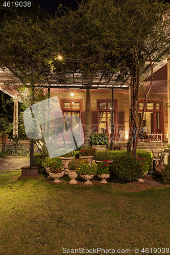 Image of Old classic style vintage home with veranda and garden