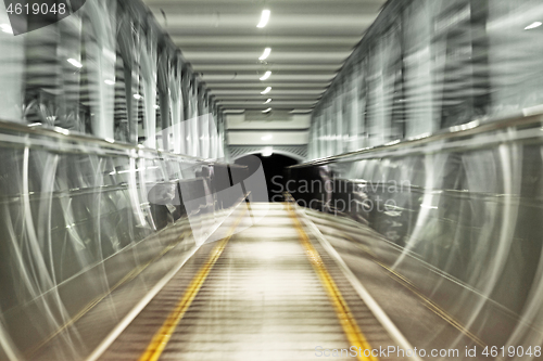 Image of Moving escalator, blurred abstract background