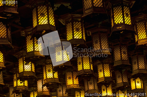 Image of Thousands of lanterns hanging on the ceiling of Buddhist temple Shrine.