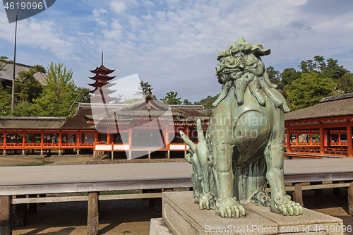 Image of Bronze statue of Komainu traditional japanese guardian lion dog, in Itsukushima Shrine in Japan.