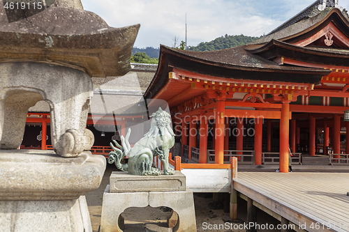 Image of Bronze statue of Komainu traditional japanese guardian lion dog, in Itsukushima Shrine in Japan.