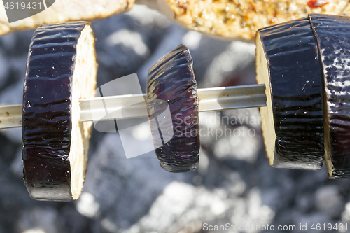 Image of Cooking eggplant on fire