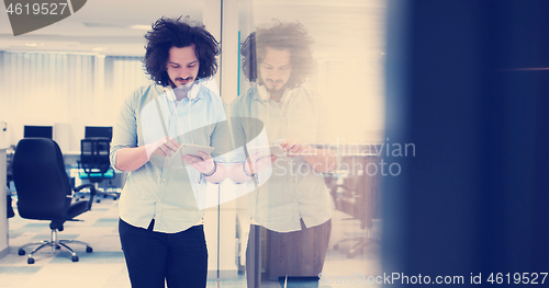 Image of businessman using tablet computer