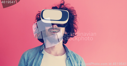 Image of young man using VR headset glasses of virtual reality