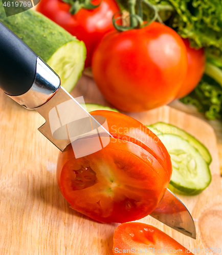 Image of Cutting Tomato Represents Vegetarian Salads And Wellness 