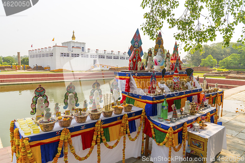 Image of Buddha birthplace in Lumbini and buddhist offerings 