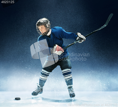 Image of Little boy playing ice hockey