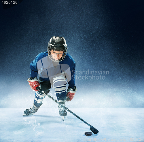 Image of Little boy playing ice hockey