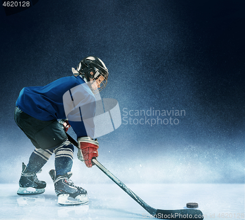 Image of Little boy playing ice hockey