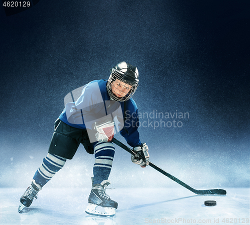 Image of Little boy playing ice hockey