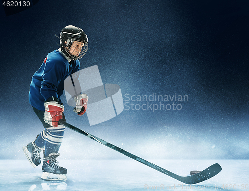 Image of Little boy playing ice hockey