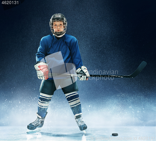 Image of Little boy playing ice hockey