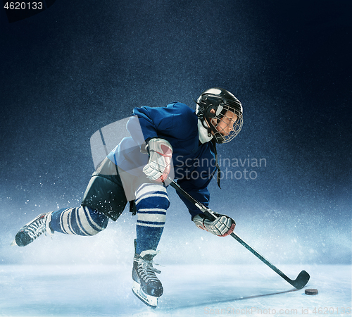 Image of Little boy playing ice hockey