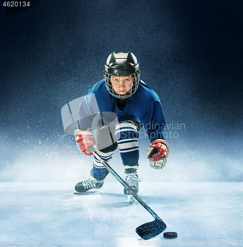 Image of Little boy playing ice hockey