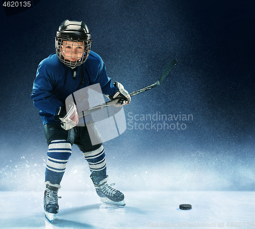 Image of Little boy playing ice hockey