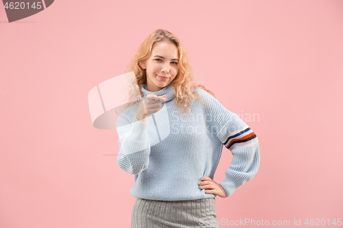 Image of The happy business woman point you and want you, half length closeup portrait on pink background.