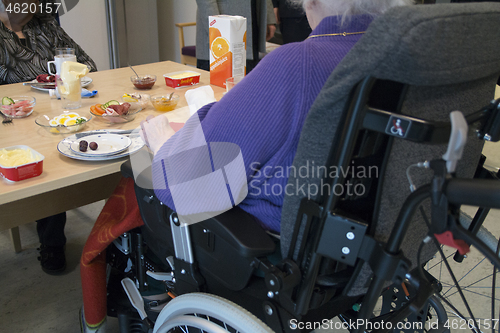 Image of Wheelchair by the Table