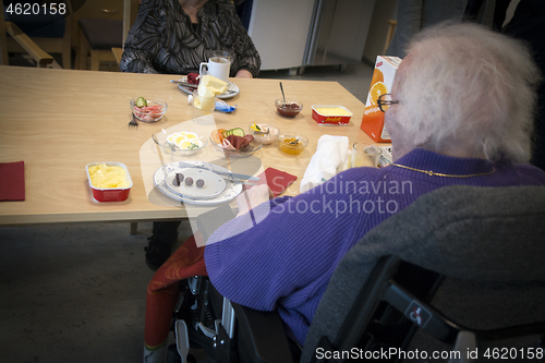 Image of Wheelchair by the Table