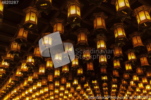 Image of Thousands of lanterns hanging on the ceiling of Buddhist temple Shrine.