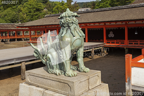 Image of Bronze statue of Komainu traditional japanese guardian lion dog, in Itsukushima Shrine in Japan.